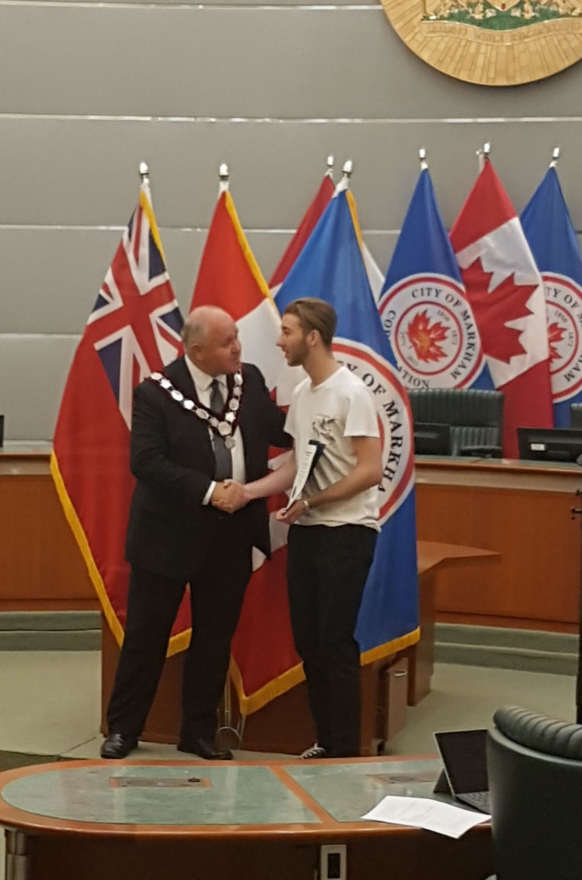 Red Bags founder Eric Stanciu being recognized by the Mayor of Markham at City Hall