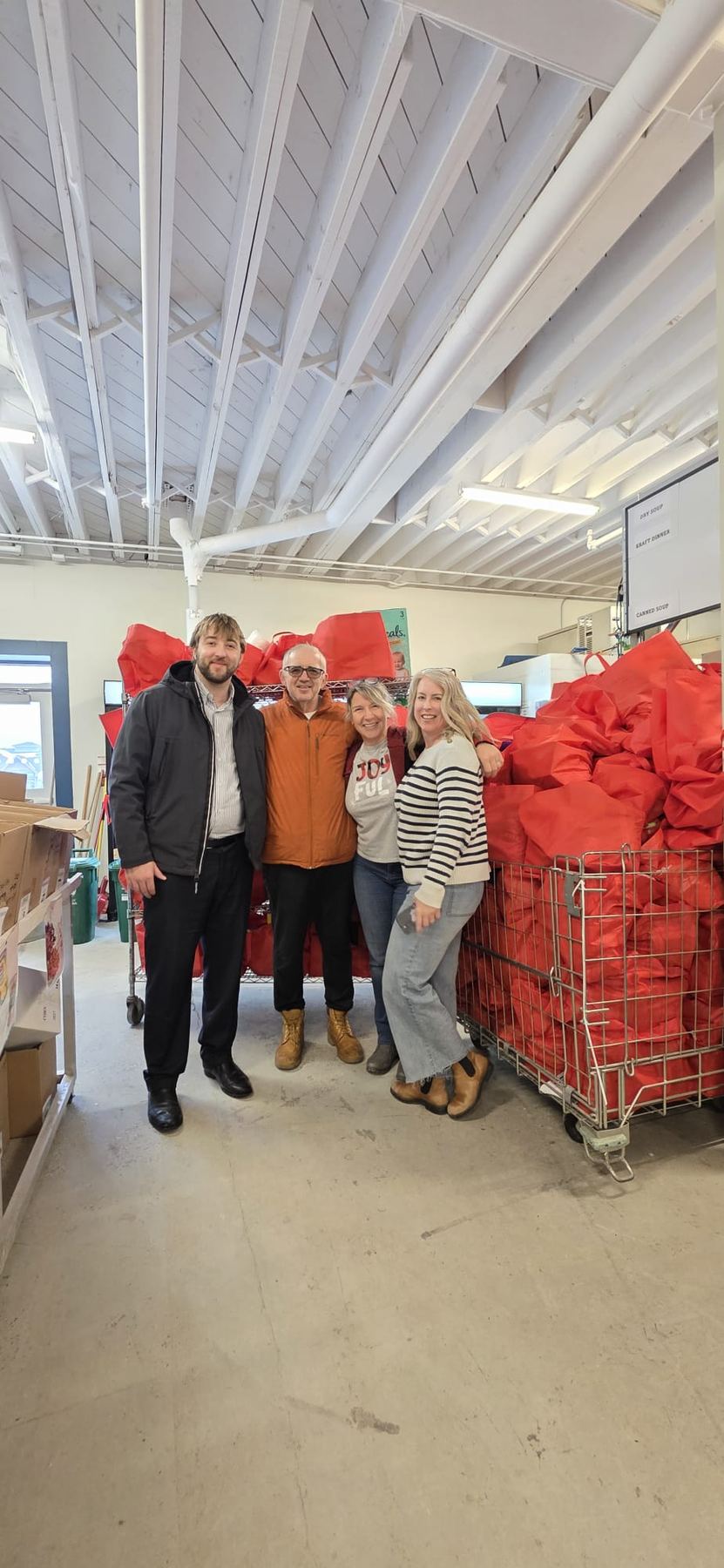 Red Bags volunteers with a cart full of filled red bags at the Georgina Food Pantry